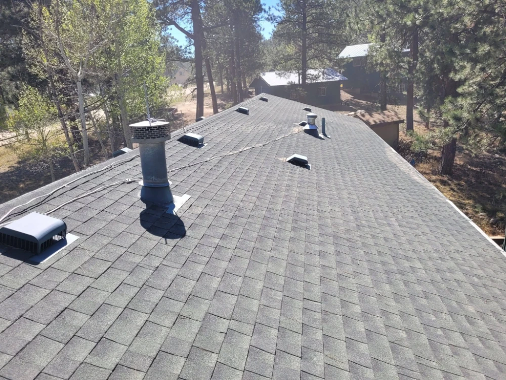 Flat low-slope roof with vent pipes, aerial view