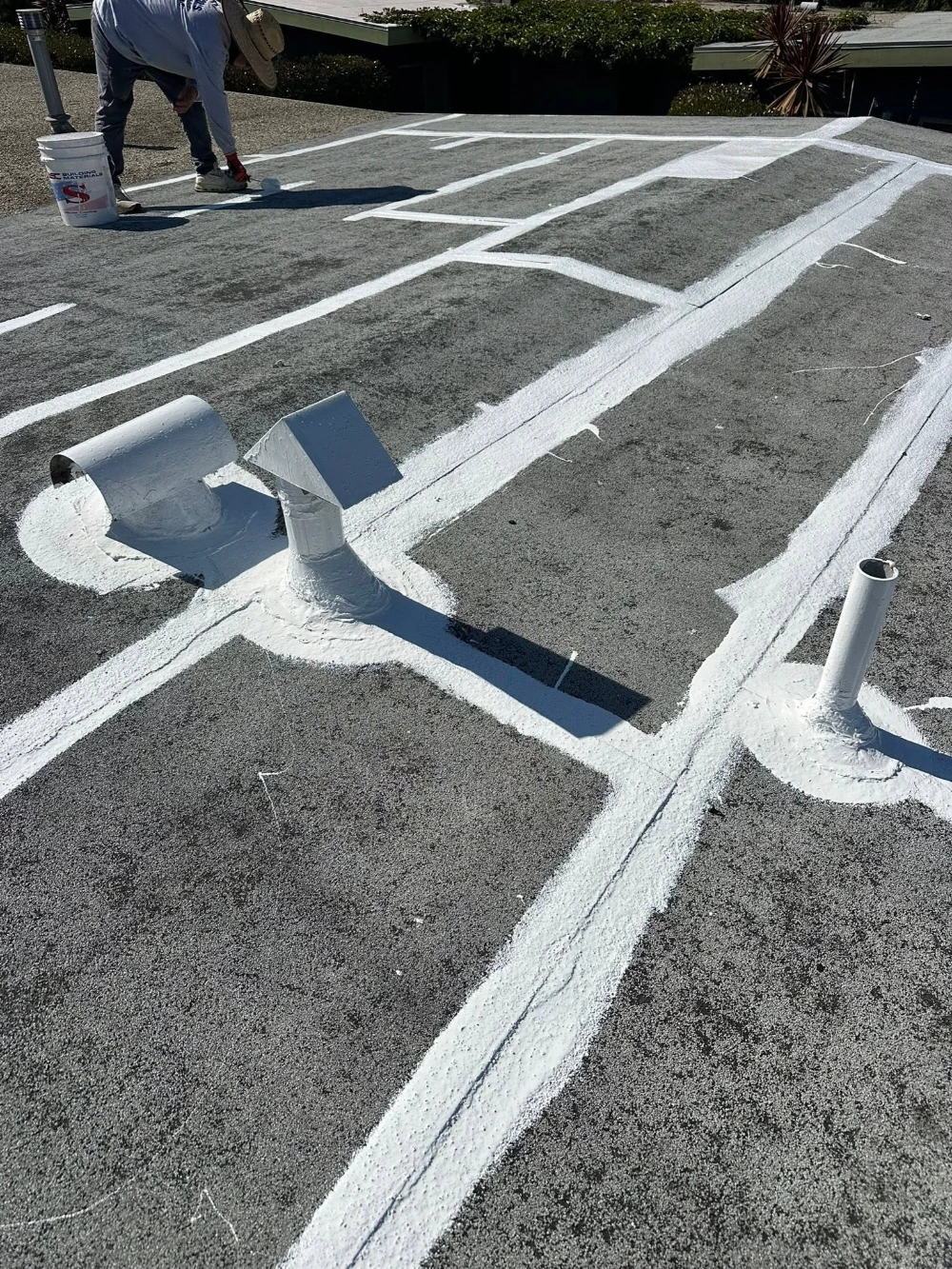 Aerial view of a taped flat roof seam during installation